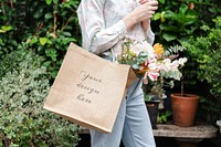 Woman with various flowers inside a bag