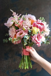 Woman holding a bouquet of flowers