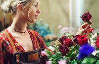 Florist arranging roses in her shop