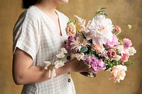 Woman holding a bouquet of flowers