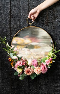 Cute round mirror decorated with flowers