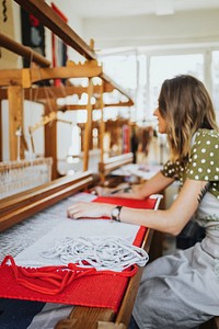 Woman weaving on a loom