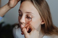 Beauty blogger curling her model eyelash
