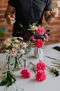 Man putting flowers in a vase