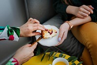 Woman cutting a slice of plum crumble pie