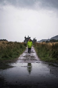 Woman in front of Kilchurn Castle, Scotland