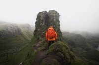 Hiker at Fairy Glen on Isle of Skye, Scotland