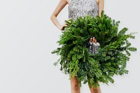 Woman holding a green Christmas wreath mockup