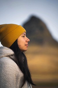 Female traveler at Kirkjufell mountain, Iceland