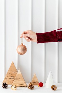 Woman holding a gold bauble