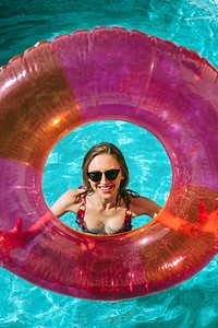 Cheerful woman in a pool