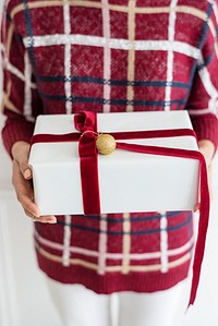 Woman holding a white present