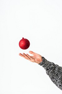 Woman catching a red bauble