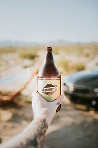 Man holding a cold beer