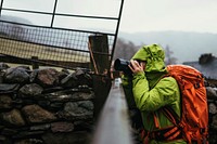 Photographer capturing the view over the fence