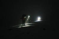 Mountaineers trekking in the cold night at Glen Coe, Scotland