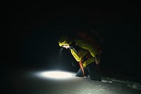 Mountaineer trekking in the cold night at Glen Coe, Scotland