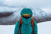 Female mountaineer climbing in wintertime at Glen Coe, Scotland