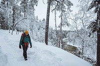 Woman trekking through a snow covered Lapland, Finland