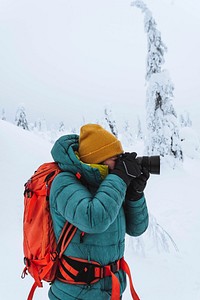 Landscape photographer capturing a snowy Lapland