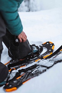 Closeup of snowshoes at a snowy peak