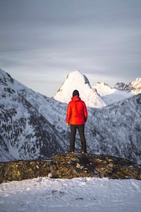 Hiker walking up Segla mountain in Norway