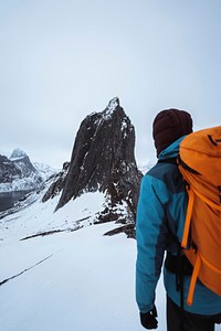 Backpacker hiking up Segla mountain, Norway