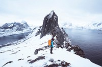 Backpacker hiking up Segla mountain, Norway