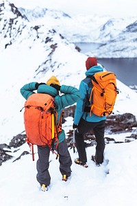 Backpackers hiking up Segla mountain, Norway