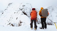 Backpackers hiking Reinebringen in the Lofoten Islands, Norway