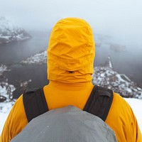 Hiker up in Reinebringen in the Lofoten Islands, Norway