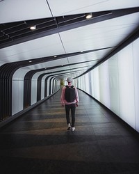Man walking through the Kings Cross tunnel