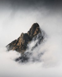 Julian Alps peak covered in heavy fog