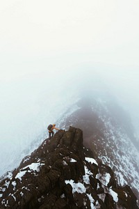 Hiker at Helvellyn summit in the English Lake District, England