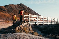 Hikers at Glen Coe valley in the Scottish Highlands