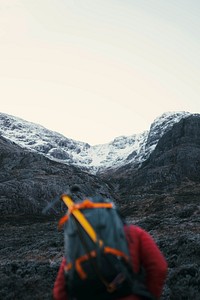 Mountaineer at Glen Coe valley in the Scottish Highlands