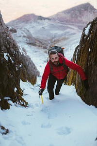 Mountaineer climbing a snow mountain