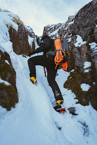 Mountaineer climbing a snow mountain