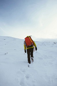 Hiker at a snowy Ben Nevis in winter