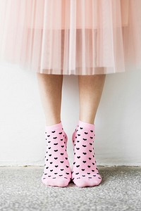 Woman in a skirt wearing pink socks