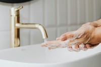 Man washing his hands with soap 