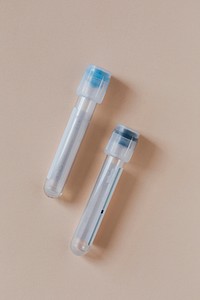Empty test tubes on a beige background 
