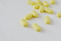 Yellow antibiotics on a white background