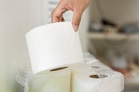 Getting a toilet paper from a pack 