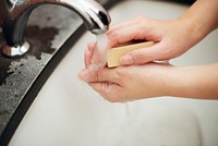 Washing hands with a bar soap to prevent coronavirus contamination