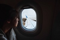 Traveler on a flight over the Atlantic ocean to the Faroe Islands