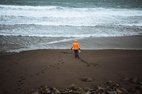 Landscape photographer at Tj&oslash;rnuv&iacute;k beach in the Faroe Islands