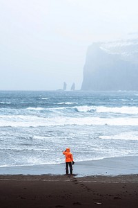Landscape photographer at Tj&oslash;rnuv&iacute;k beach in the Faroe Islands