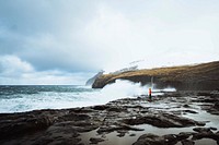 Stormy waves hitting the cliffs at Mølin beach in Streymoy, Faroe Islands