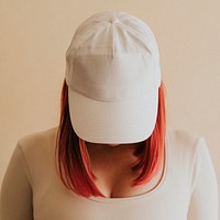 Women&#39;s white cap mockup studio shot